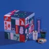 coffret gourmand bio cube bleu calendrier de l'avent mymuesli 2024 version deluxe contenant 24 muesli aux saveur chocolat, fruit , du thé et des accessoires