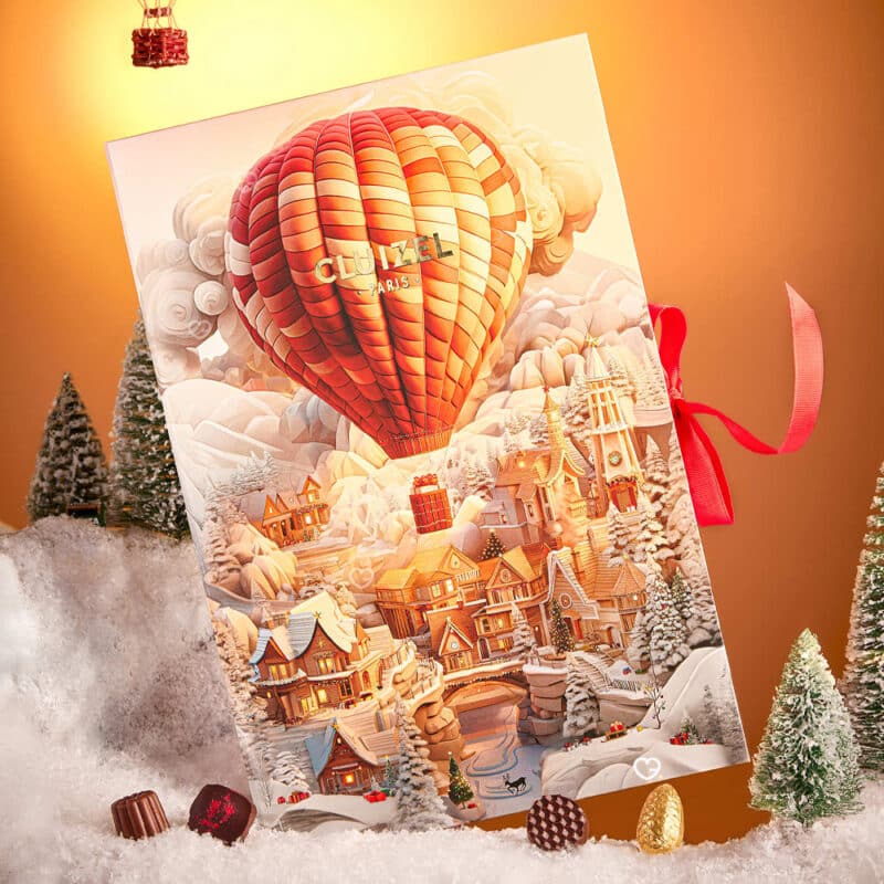 Coffret illustré voyage Calendrier de l'avent Cluizel 2024 contenant 24 délicieux chocolats