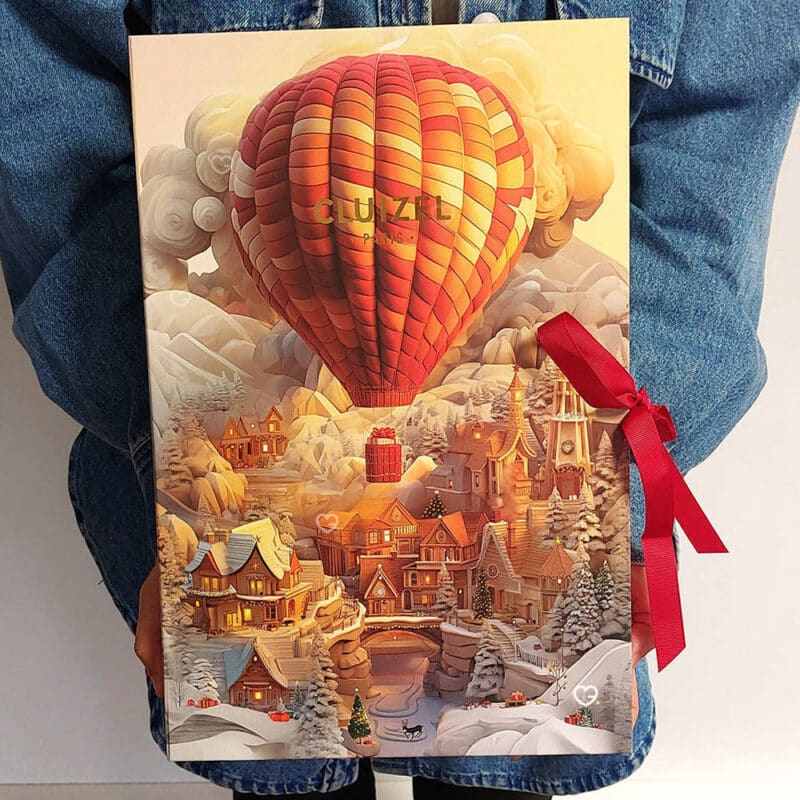Coffret illustré voyage Calendrier de l'avent Cluizel 2024 contenant 24 délicieux chocolats