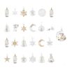 Les 25 ornements cristal du Calendrier de l'Avent Swarovski 2026 réunis : bougies, étoiles, flocons, lunes, cloches, ange, sapin, Kris Bear