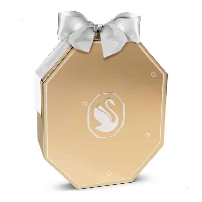Calendrier de l'Avent Swarovski 2026, coffret octogonal ton or champagne fermé, nœud gros-grain blanc, réf. 5732493