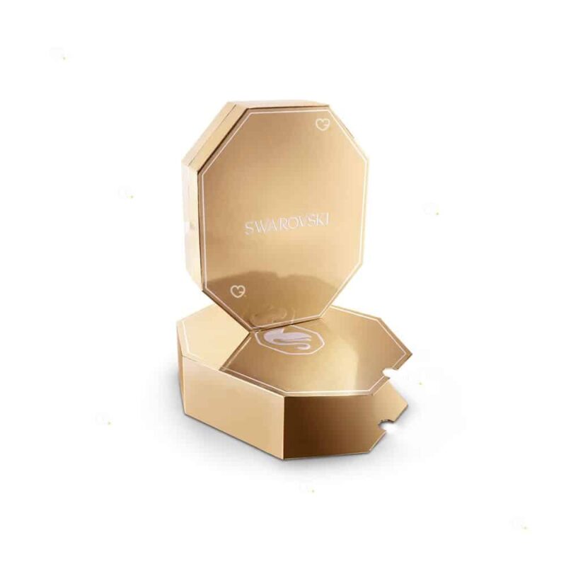 Intérieur du coffret Swarovski Annual Edition 2026 vide, motif cygne gravé sur le panneau or champagne
