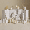 Calendrier de l’Avent The White Company 2025 en coffret blanc élégant avec 25 soins corps, bougies et parfums, idéal décoration cadeau femme