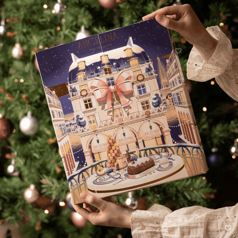 Calendrier de l’Avent Angelina 2025 raffiné, révélant 24 douceurs chocolatées et pralinées pour gourmets amoureux du luxe parisien.