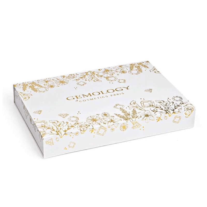 Calendrier de l’Avent Gemology 2025 contenant 24 soins beauté visage et corps en coffret luxe, idéal pour femme raffinée.