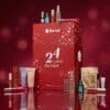 Calendrier de l'Avent Flaconi 2026 entouré de produits Dyson, Kérastase, NUXE et STARSKIN