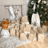 Calendrier de l’Avent Bébé 2025 pour maman et enfant. Coffret original en hotte réutilisable avec 25 surprises utiles et tendres : accessoires, soins, déco et bijou pour jeunes parents.