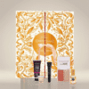 coffret beauté doré et blanc avec noeud calendrier de l'avent Glowria 2025 avec 25 produits de soins beauté multimarque pour visage corps et maquillage