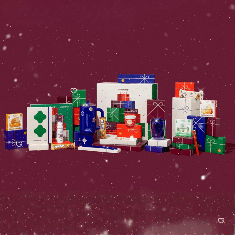 Calendrier de l’Avent Waterdrop 2025 grand format, 25 surprises gourmandes et bien-être pour adultes urbains : microdrinks fruités, accessoires et douceurs festives.