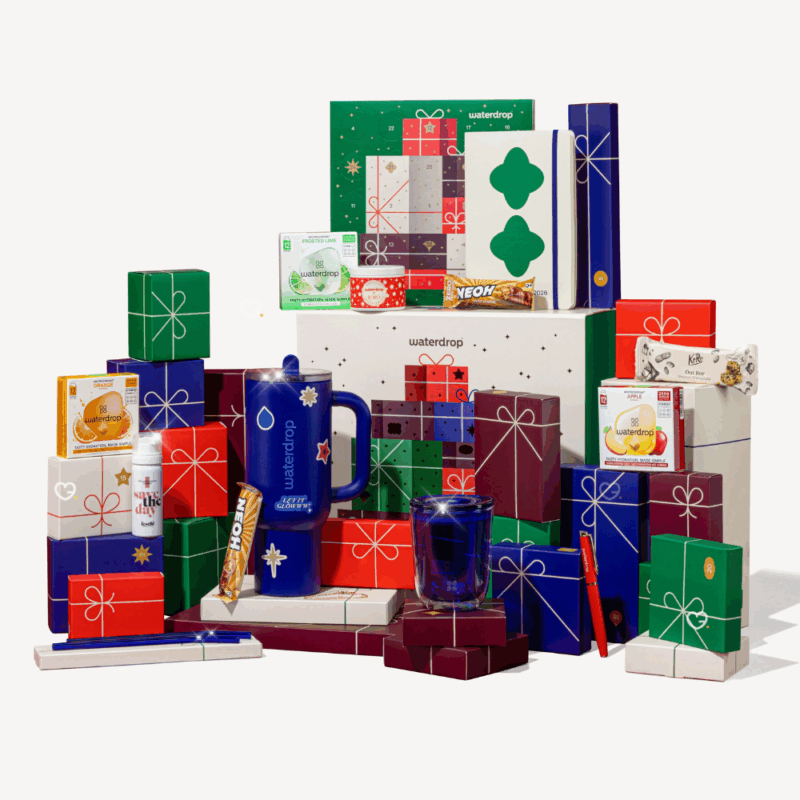 Calendrier de l’Avent Waterdrop 2025 grand format, 25 surprises gourmandes et bien-être pour adultes urbains : microdrinks fruités, accessoires et douceurs festives.