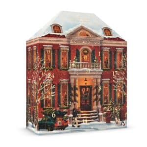 Calendrier de l'Avent Rituals Classique 2026, coffret en forme de maison de ville en briques rouges enneigee, ferme sur fond blanc