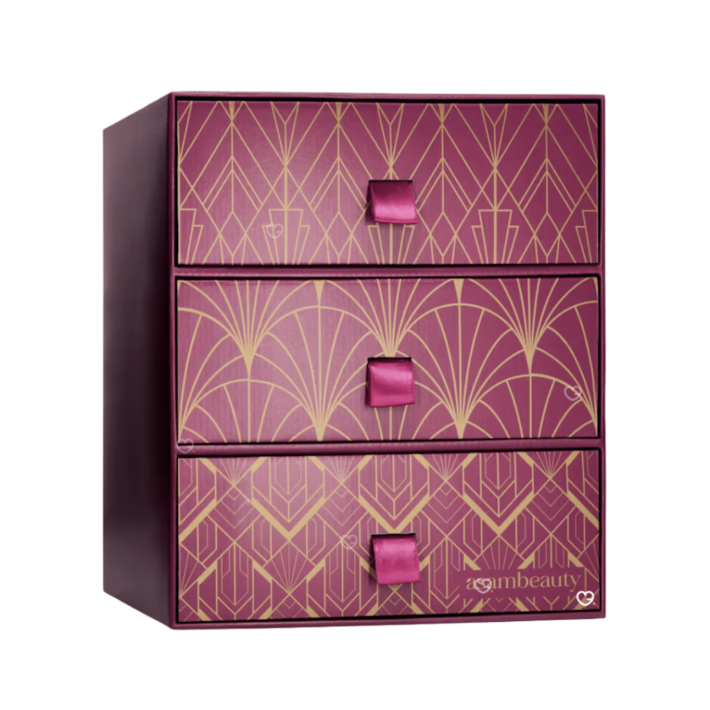 Coffret fermé du calendrier de l'Avent AsamBeauty Premium 2026, boîte violet et or à motif art déco et trois tiroirs