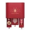 Tiroirs ouverts du calendrier Charlotte Tilbury 2026, gua sha, creme et huile visibles