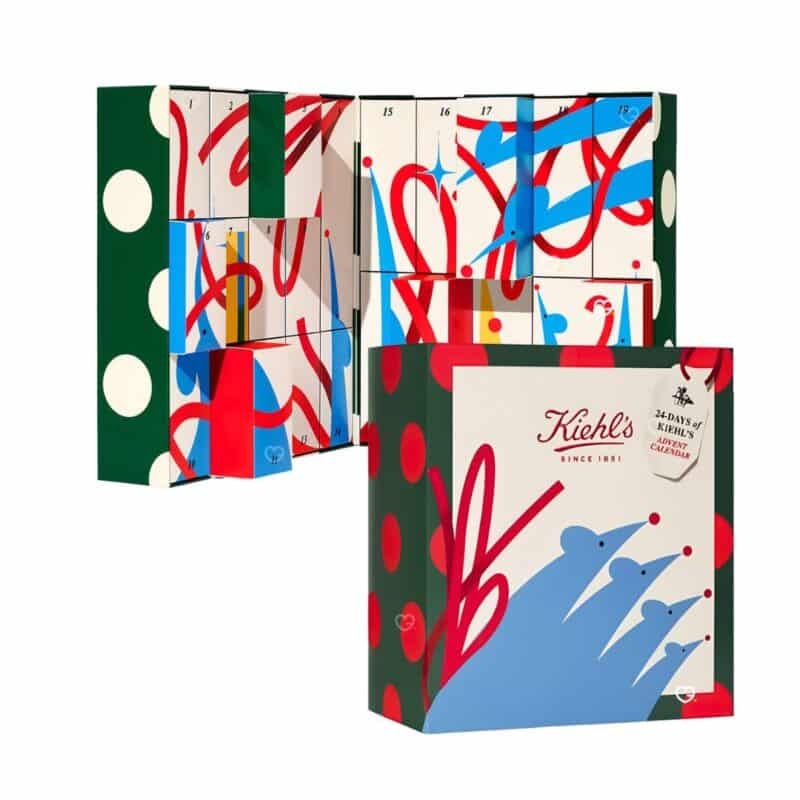 Calendrier de l'Avent Kiehl's 2026 ouvert montrant les 24 cases numérotées, fond blanc.