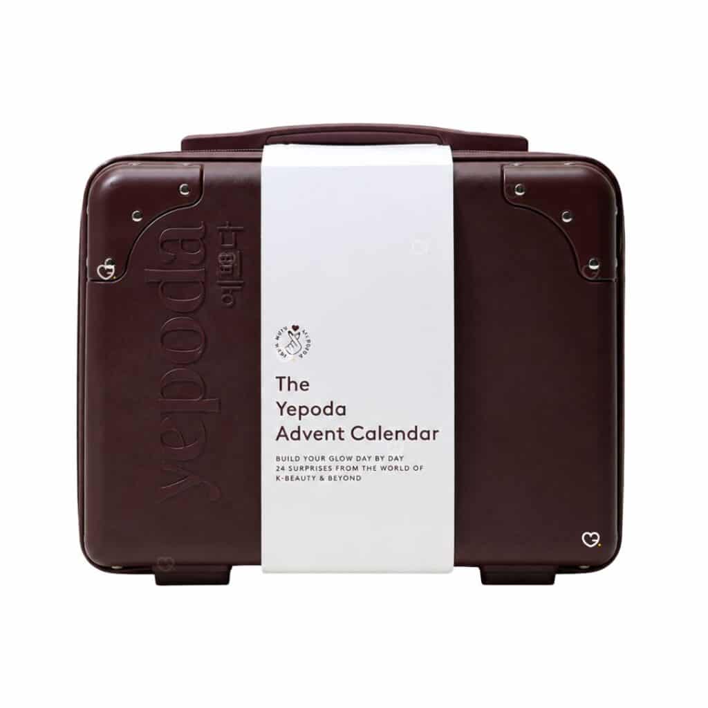 Calendrier de l Avent Yepoda 2026, valise rigide bordeaux prune fermee sur fond blanc