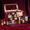 Coffret Yves Rocher Premium 2026 ouvert avec plusieurs soins et brumes disposes devant sur velours bordeaux